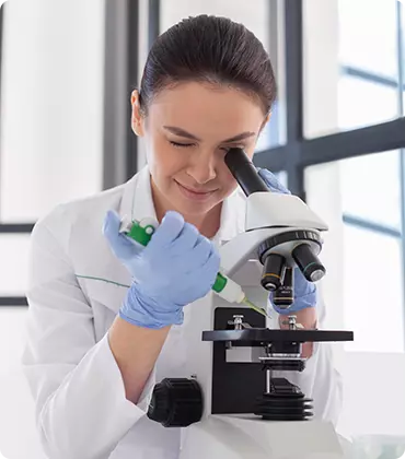 Scientist Working With Microscope